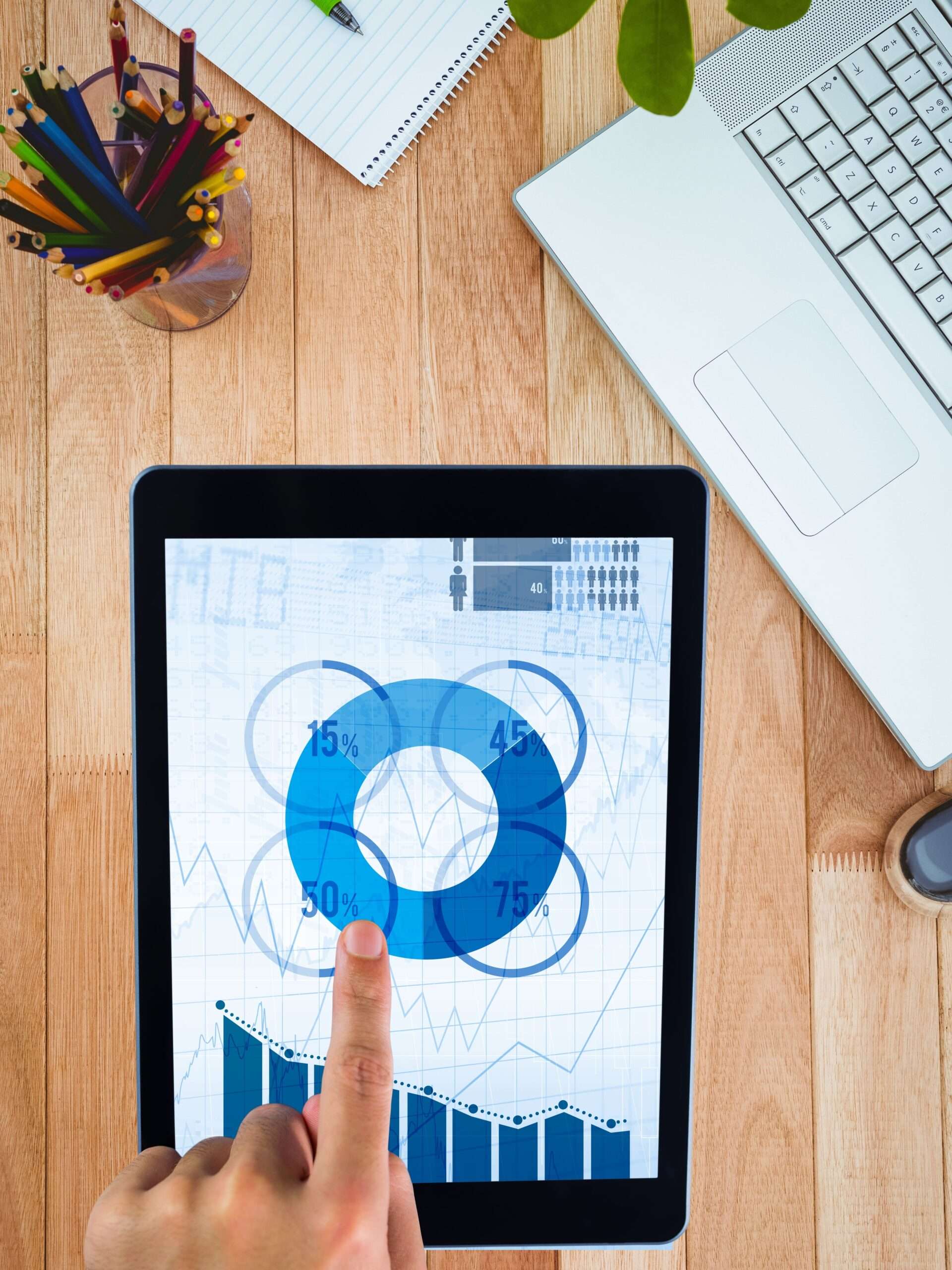 hands using tablet computer with desk background